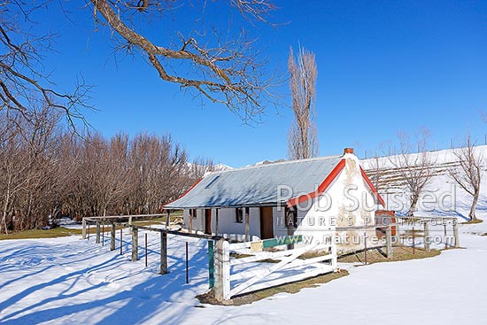 Molesworth Cob cottage Homestead, historic building in the Awatere River valley. Built in 1866 as the original Molesworth Homestead building, with winter snow, Molesworth Station, Marlborough District, Marlborough Region, New Zealand (NZ)