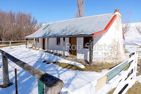 Molesworth Cob cottage Homestead, historic building in the Awatere River valley. Built in 1866 as the original Molesworth Homestead building, with winter snow, Molesworth Station, Marlborough District, Marlborough Region, New Zealand (NZ)