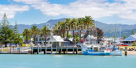 Whitianga foreshore with fishing boats alongside wharf on the Esplanade beside the Harbour entrance. Panorama, Whitianga, Coromandel Peninsula, Thames-Coromandel District, Waikato Region, New Zealand (NZ)