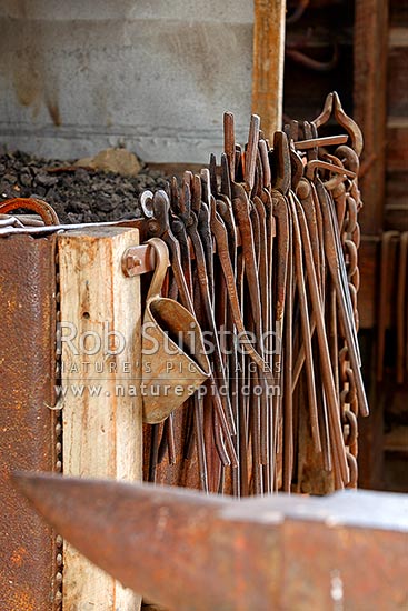 Blacksmith tools, anvil and forge inside the smithy 